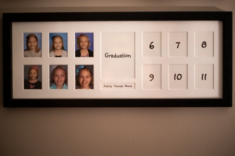 A black frame with white matting contains 6 small photos of Hannah. Empty boxes on the right are for grades 6 to 11 and an empty boxes labeled graduation is in the middle.