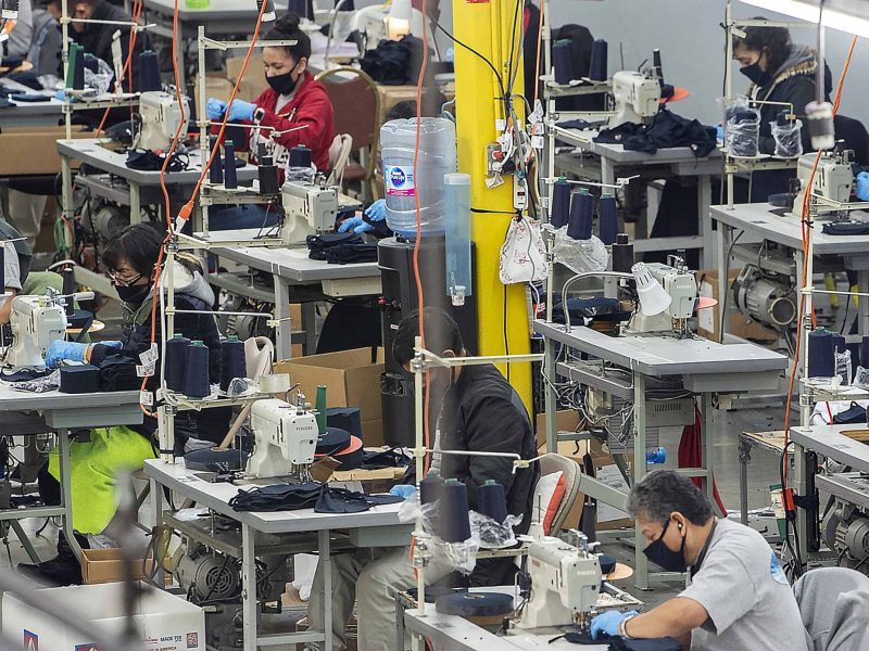 Several workers in the garment industry sew masks to meet the coronavirus demand.