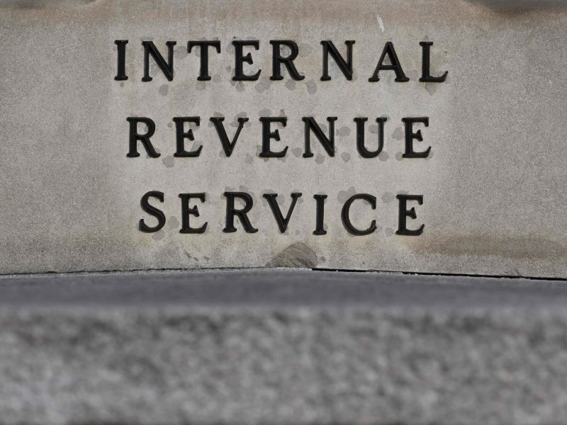 An up-close photo of the Internal Revenue Service sign on the headquarters.