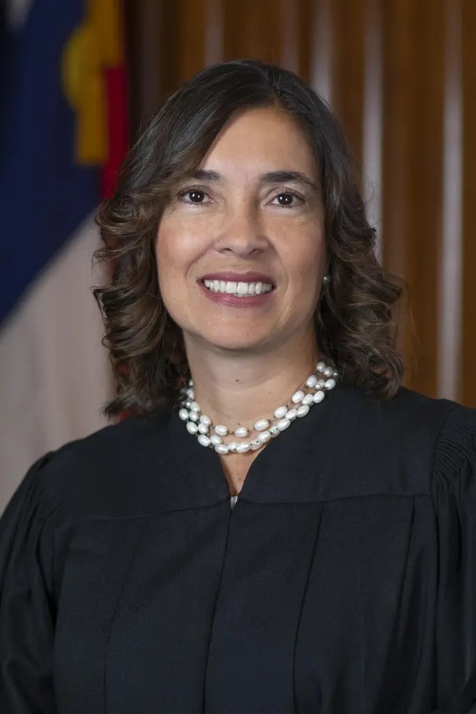 North Carolina Supreme Court Associate Justice Anita Earls poses in her judicial robe.
