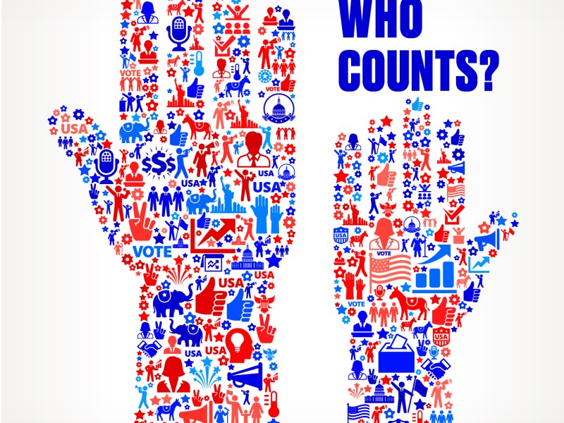 An illustration of two hands raised. The hands are constructed of voting symbols, like a ballot box, an elephant, a donkey and the US capitol.